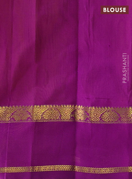 Silk cotton saree mustard yellow and purple with plain body and rettapet zari woven border