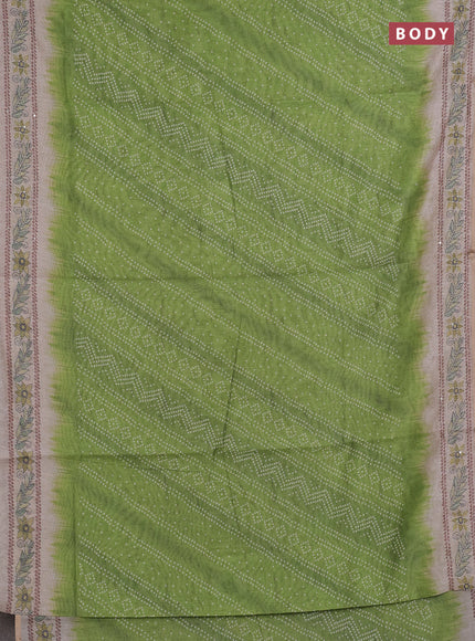 Semi linen saree light green and beige with allover bandhani prints and embroidery pallu & border
