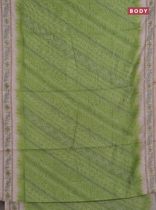 Semi linen saree light green and beige with allover bandhani prints and embroidery pallu & border
