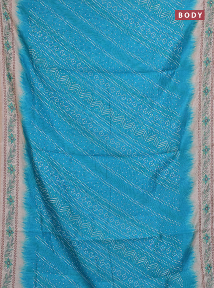 Semi linen saree cs blue and beige with allover bandhani prints and embroidery pallu & border