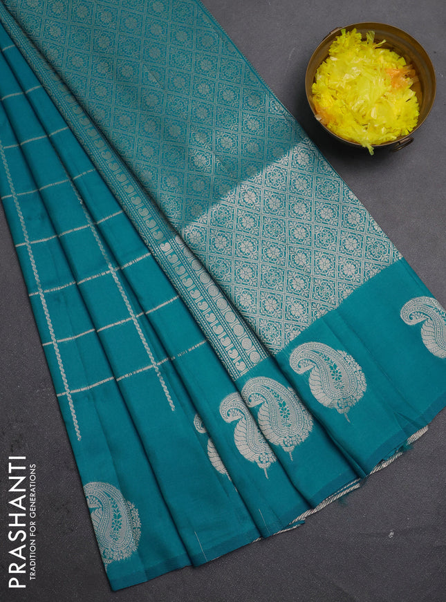 Semi soft silk saree teal blue with allover zari woven checked pattern and paisley zari woven butta border