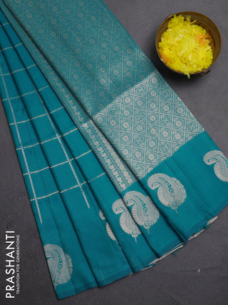 Semi soft silk saree teal blue with allover zari woven checked pattern and paisley zari woven butta border