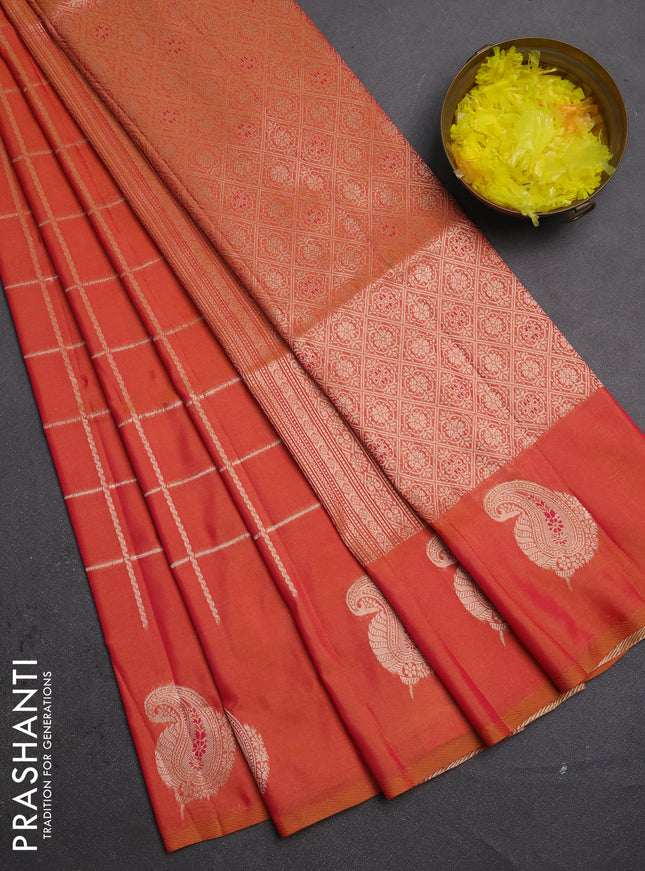Semi soft silk saree sunset orange with allover zari woven checked pattern and paisley zari woven butta border