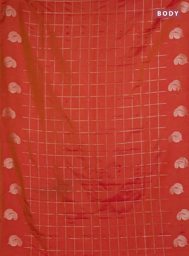 Semi soft silk saree sunset orange with allover zari woven checked pattern and paisley zari woven butta border