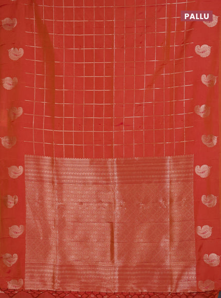 Semi soft silk saree sunset orange with allover zari woven checked pattern and paisley zari woven butta border