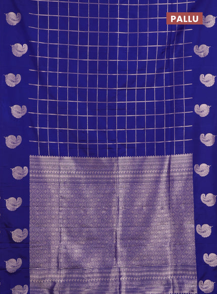 Semi soft silk saree navy blue with allover zari woven checked pattern and paisley zari woven butta border