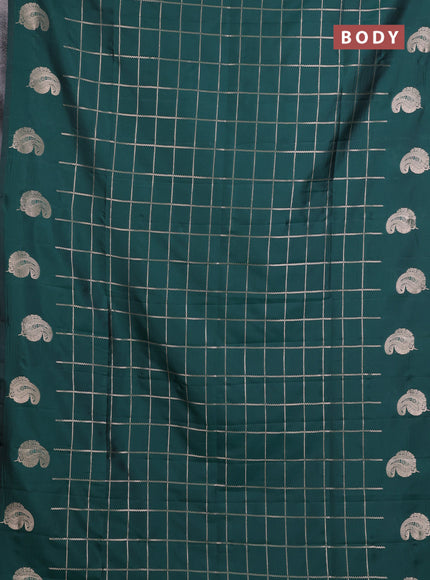 Semi soft silk saree bottle green with allover zari woven checked pattern and paisley zari woven butta border