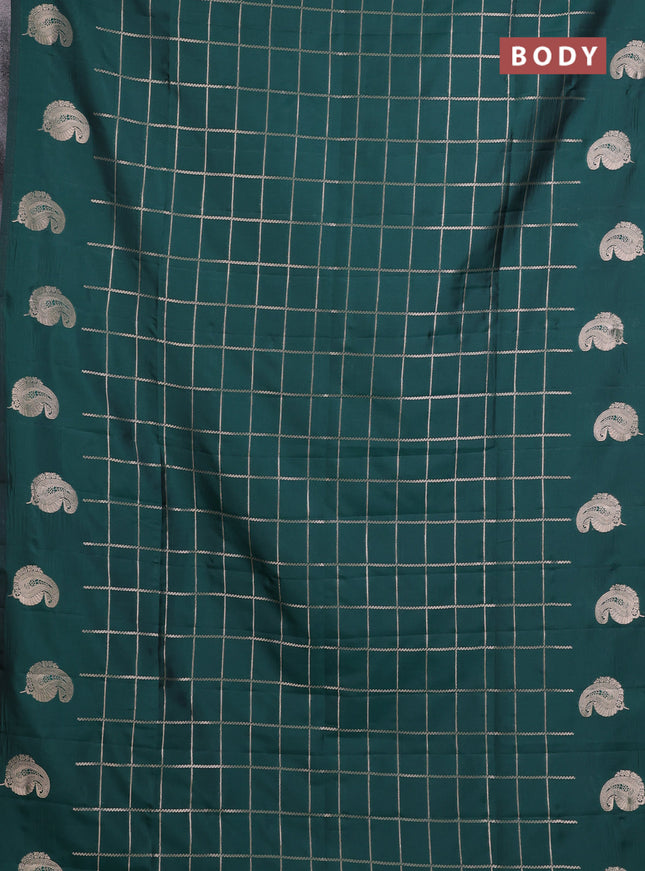 Semi soft silk saree bottle green with allover zari woven checked pattern and paisley zari woven butta border