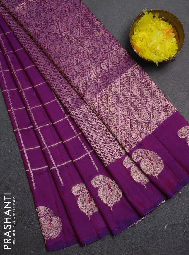 Semi soft silk saree purple with allover zari woven checked pattern and paisley zari woven butta border