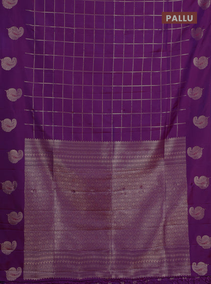 Semi soft silk saree purple with allover zari woven checked pattern and paisley zari woven butta border