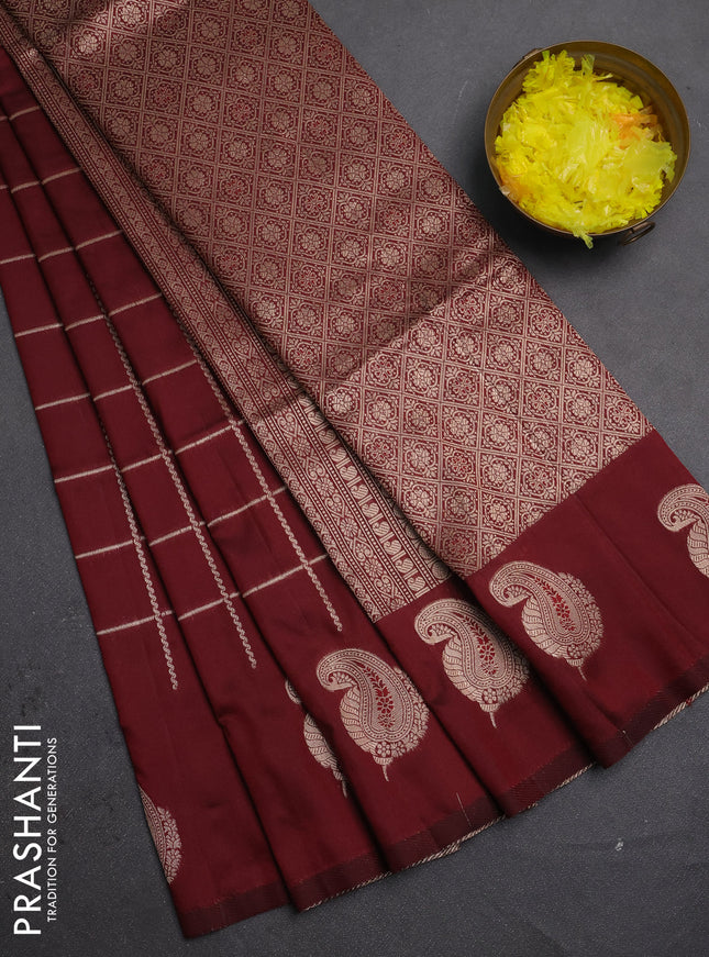 Semi soft silk saree maroon with allover zari woven checked pattern and paisley zari woven butta border