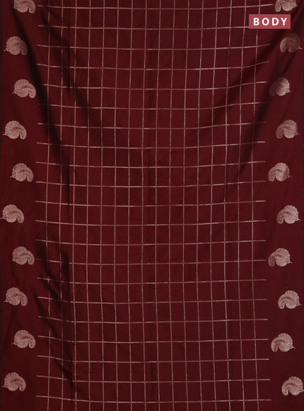 Semi soft silk saree maroon with allover zari woven checked pattern and paisley zari woven butta border