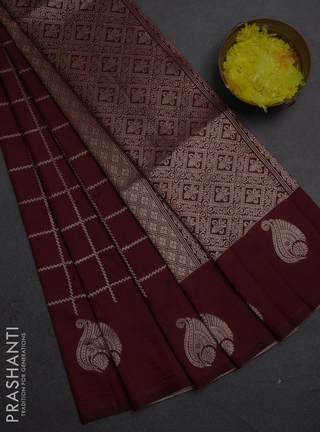 Semi soft silk saree maroon with allover zari woven checked pattern and paisley zari woven butta border