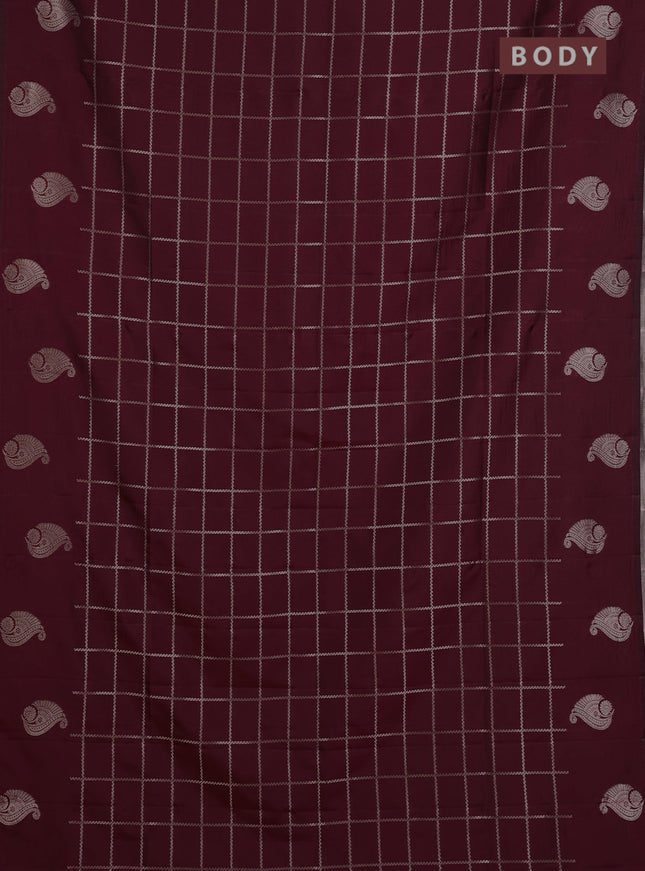 Semi soft silk saree maroon with allover zari woven checked pattern and paisley zari woven butta border