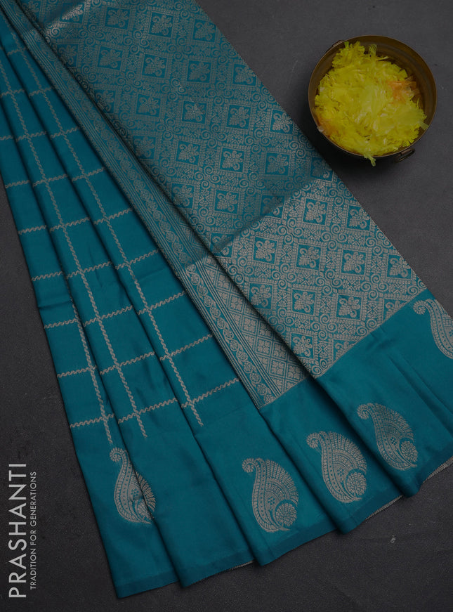 Semi soft silk saree teal blue with allover zari woven checked pattern and paisley zari woven butta border