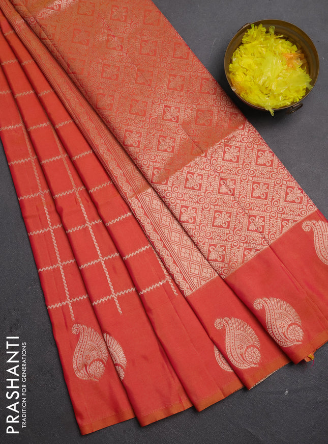 Semi soft silk saree sunset orange with allover zari woven checked pattern and paisley zari woven butta border