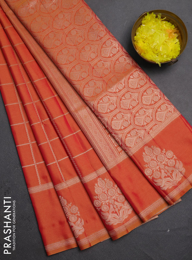 Semi soft silk saree sunset orange with allover zari woven checked pattern and zari woven butta border