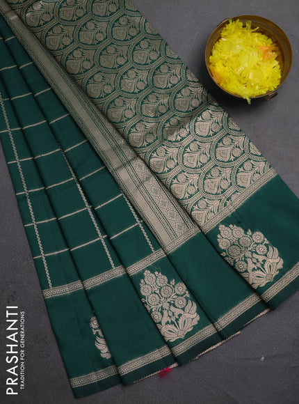 Semi soft silk saree bottle green with allover zari woven checked pattern and zari woven butta border