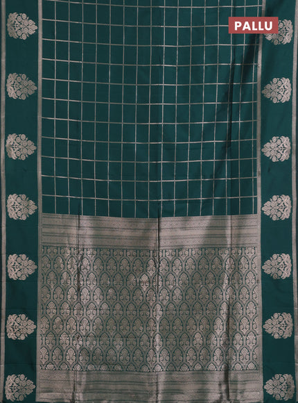 Semi soft silk saree bottle green with allover zari woven checked pattern and zari woven butta border