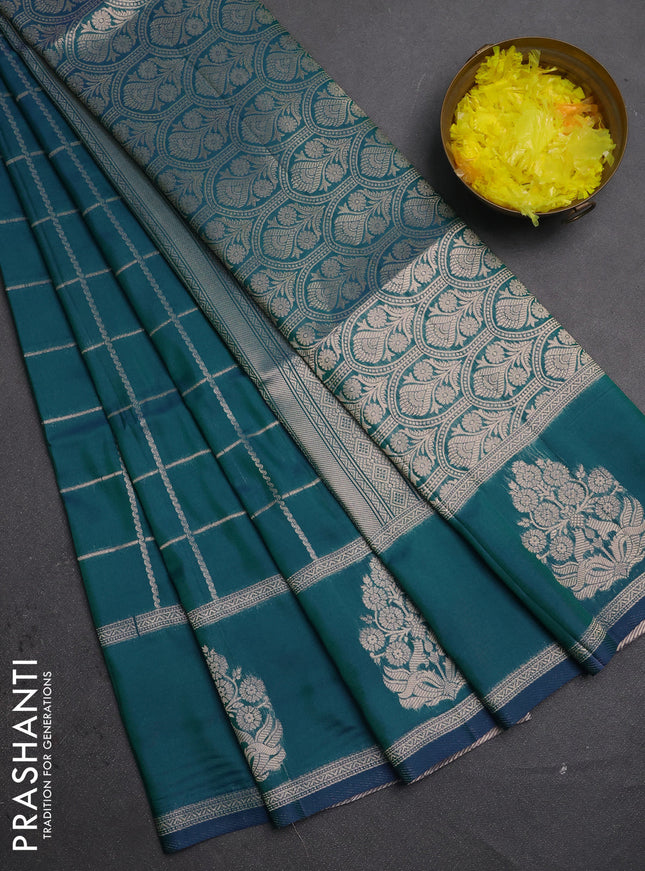 Semi soft silk saree peacock green with allover zari woven checked pattern and zari woven butta border