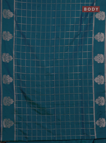 Semi soft silk saree peacock green with allover zari woven checked pattern and zari woven butta border