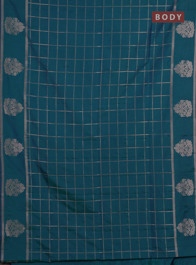Semi soft silk saree peacock green with allover zari woven checked pattern and zari woven butta border