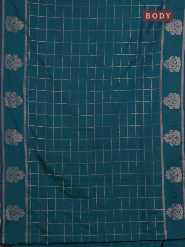 Semi soft silk saree peacock green with allover zari woven checked pattern and zari woven butta border