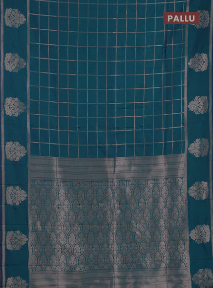Semi soft silk saree peacock green with allover zari woven checked pattern and zari woven butta border