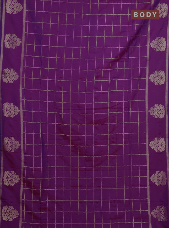 Semi soft silk saree purple with allover zari woven checked pattern and zari woven butta border