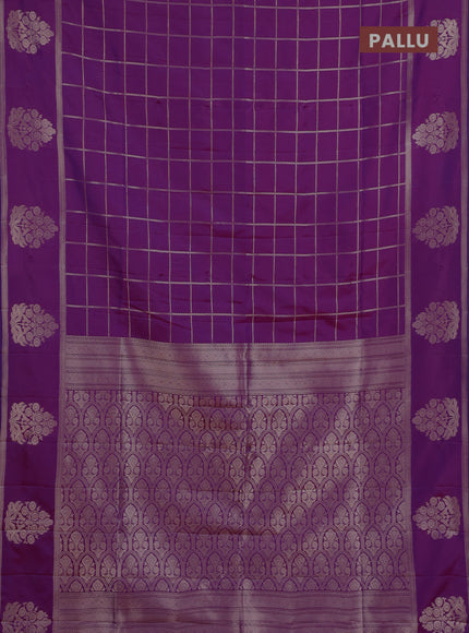 Semi soft silk saree purple with allover zari woven checked pattern and zari woven butta border