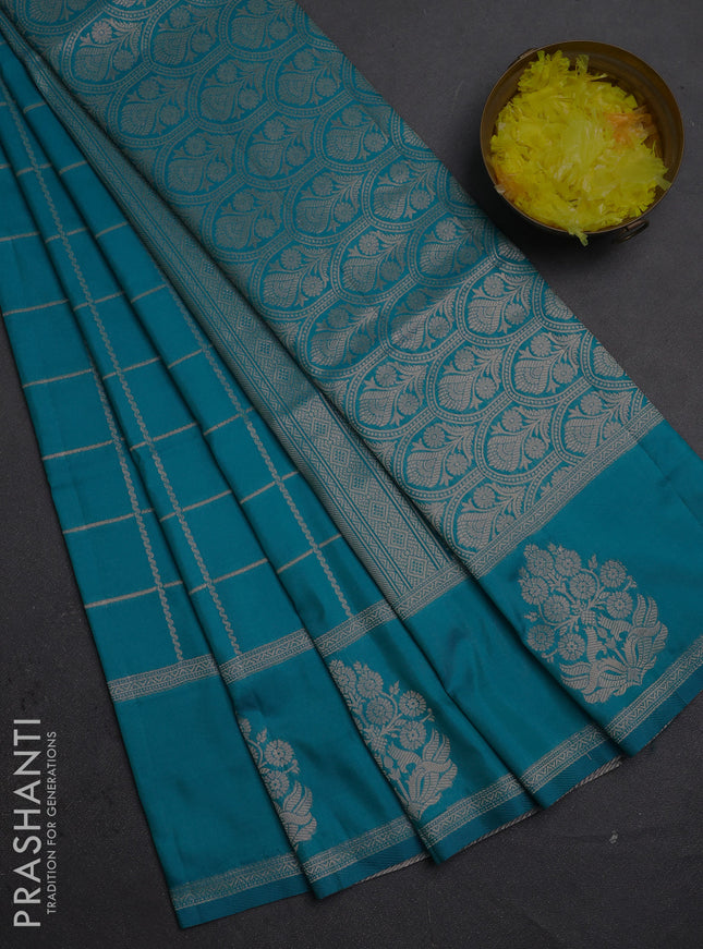 Semi soft silk saree teal blue with allover zari woven checked pattern and zari woven butta border
