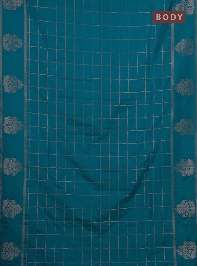 Semi soft silk saree teal blue with allover zari woven checked pattern and zari woven butta border