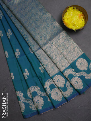 Semi soft silk saree teal green with allover zari woven buttas and zari woven butta border