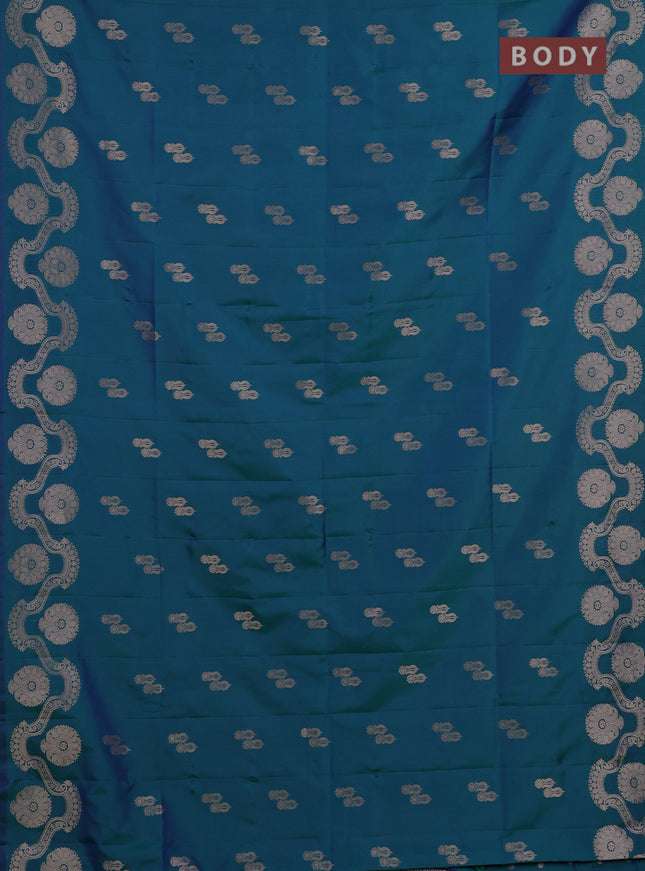 Semi soft silk saree teal green with allover zari woven buttas and zari woven butta border