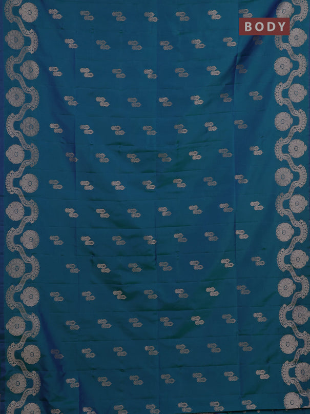 Semi soft silk saree teal green with allover zari woven buttas and zari woven butta border