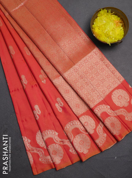 Semi soft silk saree sunset orange with allover zari woven buttas and zari woven butta border