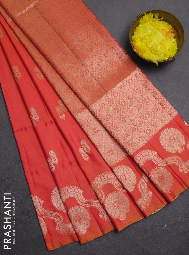 Semi soft silk saree sunset orange with allover zari woven buttas and zari woven butta border