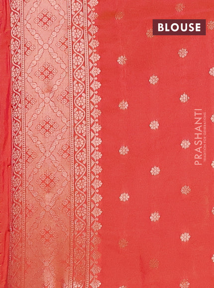 Semi soft silk saree sunset orange with allover zari woven buttas and zari woven butta border