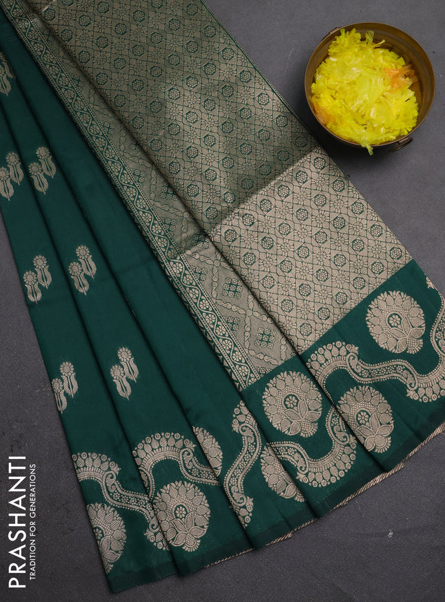 Semi soft silk saree bottle green with allover zari woven buttas and zari woven butta border