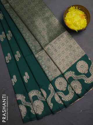 Semi soft silk saree bottle green with allover zari woven buttas and zari woven butta border