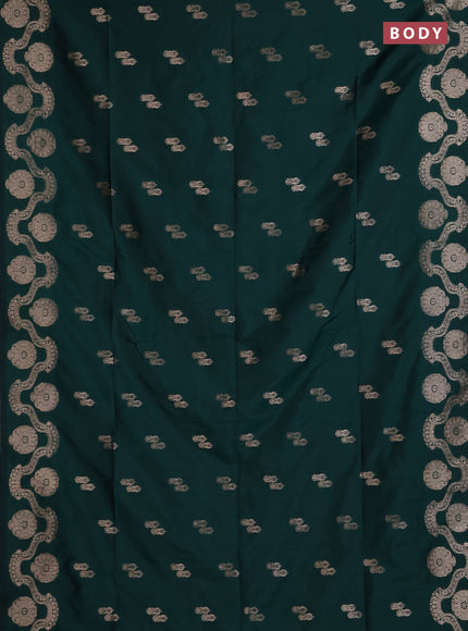 Semi soft silk saree bottle green with allover zari woven buttas and zari woven butta border
