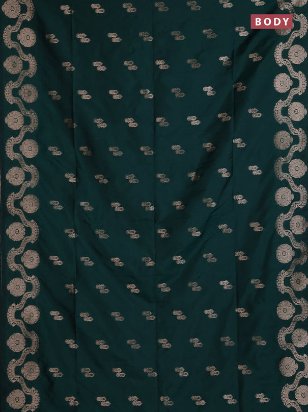 Semi soft silk saree bottle green with allover zari woven buttas and zari woven butta border
