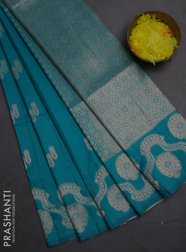 Semi soft silk saree teal blue with allover zari woven buttas and zari woven butta border