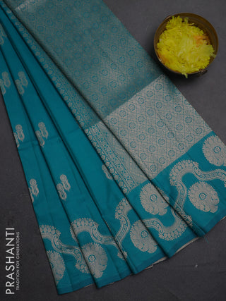 Semi soft silk saree teal blue with allover zari woven buttas and zari woven butta border