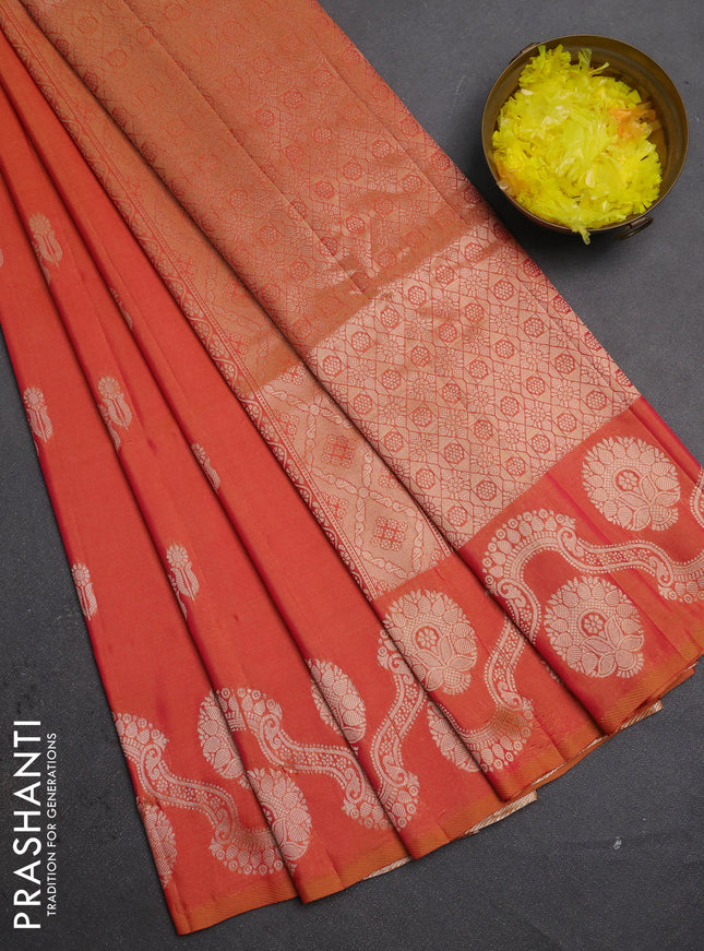 Semi soft silk saree sunset orange with allover zari woven buttas and zari woven butta border