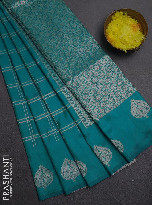 Semi soft silk saree teal blue with allover zari woven checked pattern and zari woven butta border