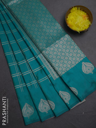 Semi soft silk saree teal blue with allover zari woven checked pattern and zari woven butta border