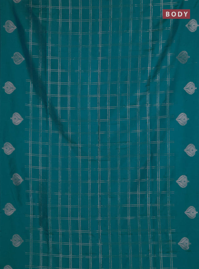 Semi soft silk saree teal blue with allover zari woven checked pattern and zari woven butta border