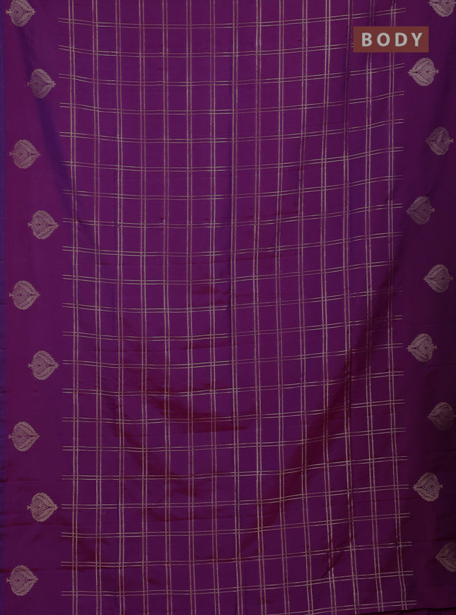 Semi soft silk saree purple with allover zari woven checked pattern and zari woven butta border