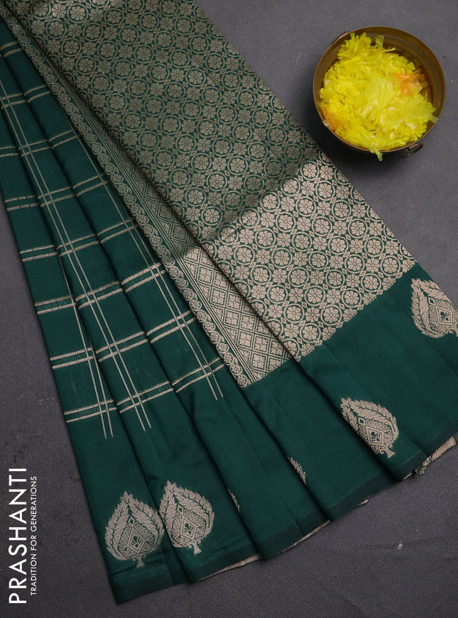 Semi soft silk saree bottle green with allover zari woven checked pattern and zari woven butta border
